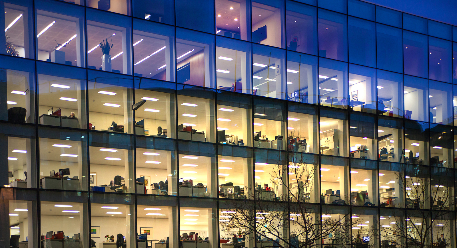 office glass partition - Office block with lots of lit up windows